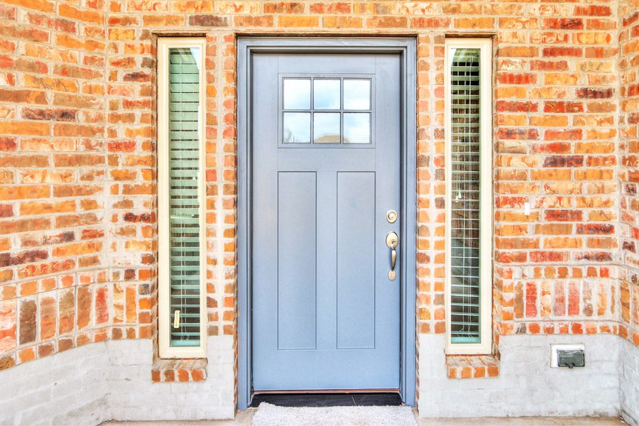 Front door of a brick house and door designed by Semco Construction