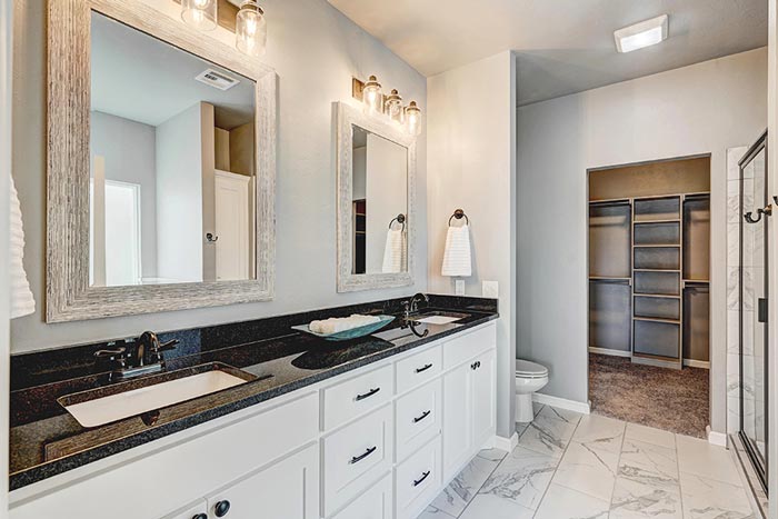 Interior bathroom designed by Semco Construction with black marble countertop